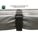Image of a close-up on the Overland Vehicle Systems' Nomadic 180 Awning being secured for storage. A heavy-duty Velcro strap is wrapped around the folded gray awning fabric and aluminum frame to keep it in place