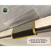 Image of a close-up on the Overland Vehicle Systems' Nomadic 180 Awning frame, showing the awning fabric and the support pole attached with a Velcro strap to the aluminum arm. Text on the image points out that all seams are heat-sealed for durability