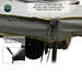 Image of the tie-down points on the Overland Vehicle Systems Nomadic 180 Awning, showing both the main corner tie-down and a closer inset image of the side tie-down. The text highlights that the awning can be used free-standing or with a structured pole setting