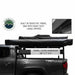 Image of the OVS Nomadic 180° Awning secured in its black travel cover on a vehicle rack, with an inset showing the zipper detail and the cover dimensions
