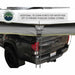 Image of the OVS Nomadic 180° Awning showing a close-up of an additional tie-down point with a rope attached, designed for water run-off to prevent puddling during storms