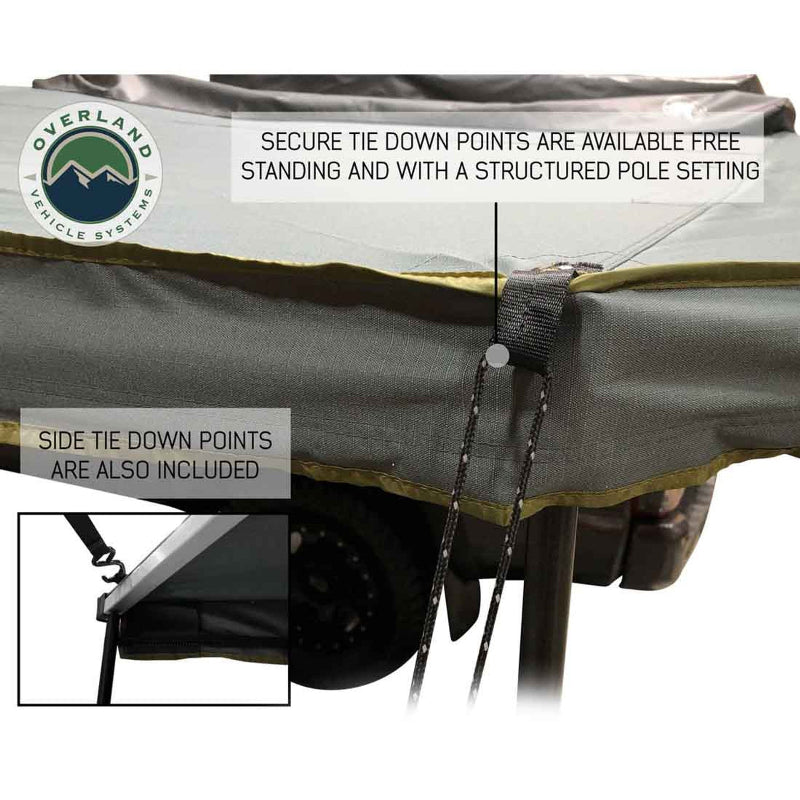 Image of a close-up of the OVS Nomadic 180° Awning showing a side tie-down point with an attached rope and an inset image of another tie-down point with a strap for a free-standing setup
