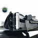 Image of a black rooftop tent cover unzipped, revealing the folded aluminum frame and gray fabric of an awning. The "OVERLAND VEHICLE SYSTEMS" logo is in the top left corner, with a white background behind the product