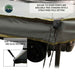 Image of a gray awning with a tie-down strap and cord, demonstrating the "free standing with a structured pole setting" feature. An inset photo shows a close-up of the "side tie-down points"