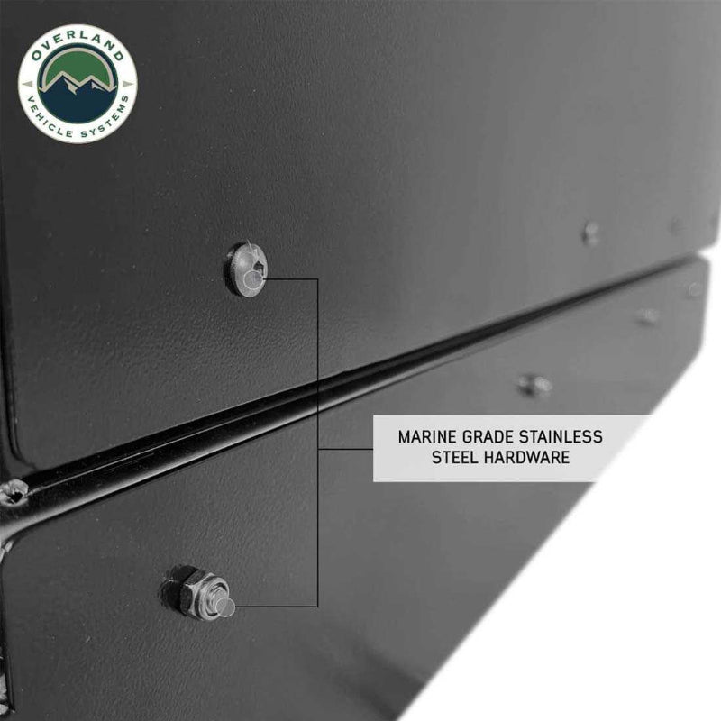 Image of Overland Vehicle Systems slide-out camping storage system hardware detail showing marine-grade stainless steel fasteners on black powder-coated steel, close-up angled side view on a white background.