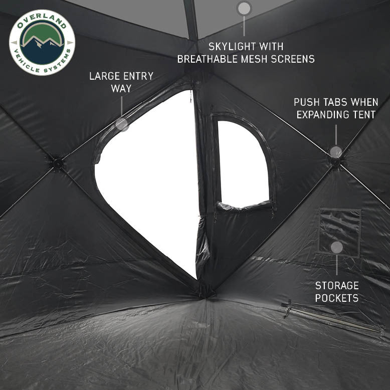 Image of OVS hub-style camping tent interior showing large entry door, skylight with breathable mesh screens, storage pockets, and push-tab frame system, wide interior view on a neutral background.