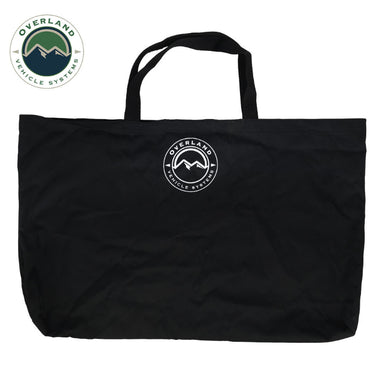 Image of black carry tote bag with Overland Vehicle Systems logo, soft fabric construction with dual handles, front-facing view on white background.