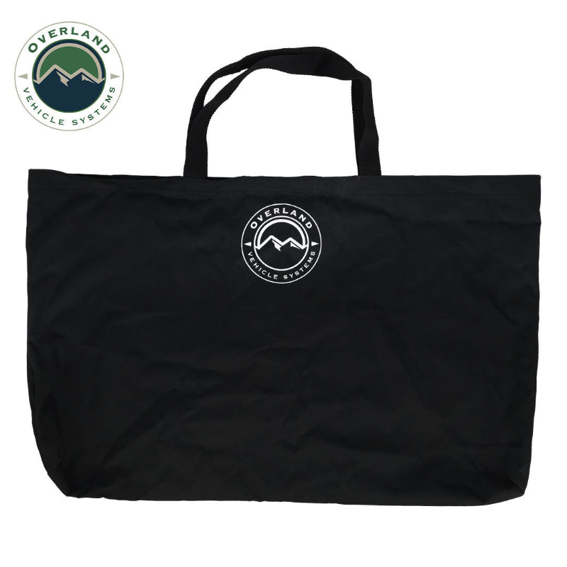 Image of black carry tote bag with Overland Vehicle Systems logo, soft fabric construction with dual handles, front-facing view on white background.
