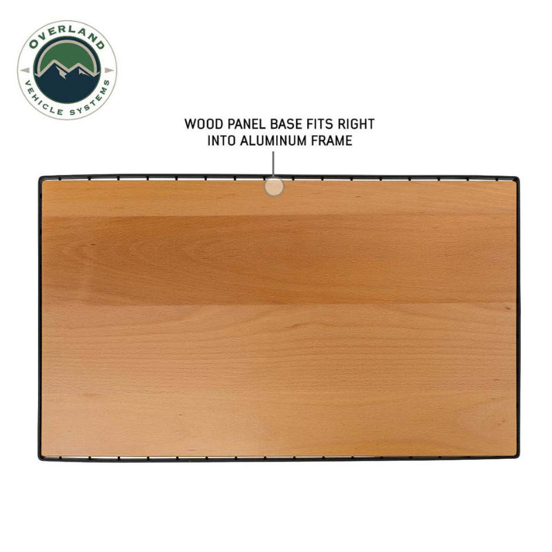 Image of camp table wood panel base fitted into black aluminum frame, top-down view highlighting natural wood finish on white background.