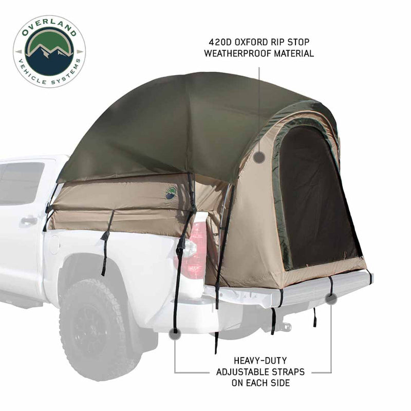 Image of a pickup truck bed tent installed on a white truck, olive green and tan 420D ripstop weatherproof fabric with rear mesh door and heavy-duty adjustable straps, angled side and rear view on white background.