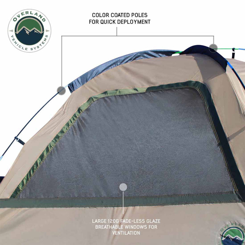 Image of a truck bed tent close-up showing tan and olive green fabric with large breathable mesh window and color-coded poles for quick setup, angled detail view on white background.