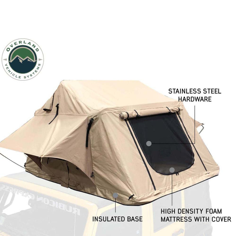 Image of a beige rooftop tent, highlighting its features: stainless steel hardware, an insulated base, and a high-density foam mattress with cover, against a white background with a faint vehicle outline.