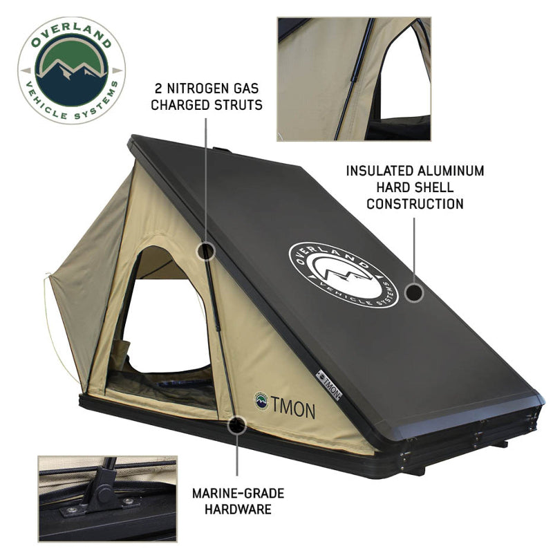 Image displaying the interior of an Overland Vehicle Systems tent, showcasing a high-density foam mattress and an overhead storage loft for accessories, bedding, and clothing. The tent walls are grey with black mesh accents