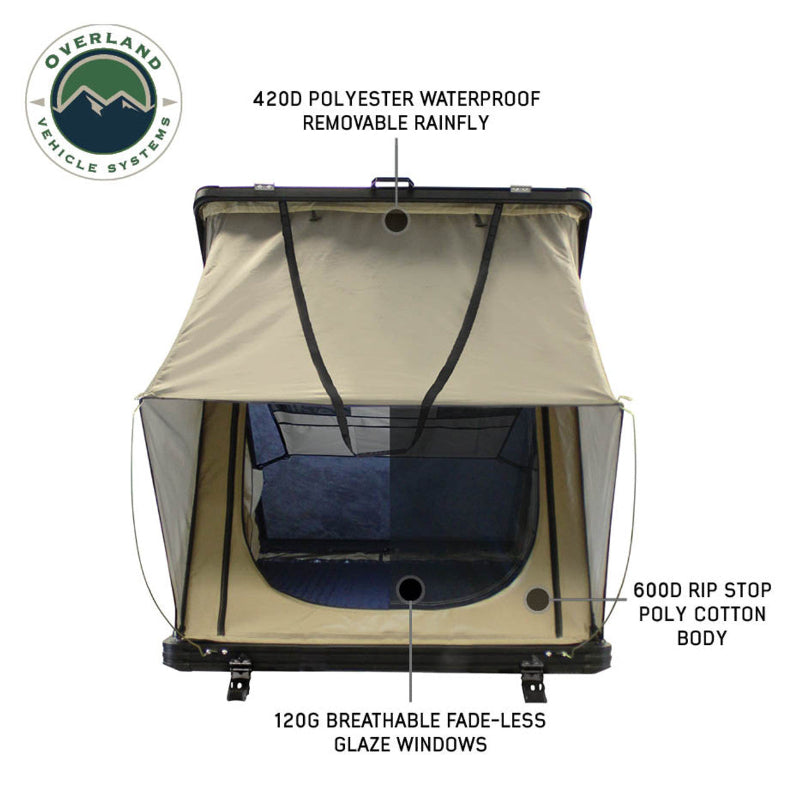 Image displaying an olive green Overland Vehicle Systems roof top tent, fully deployed, with a large transparent skylight window in the rainfly. The tent is shown against a white background