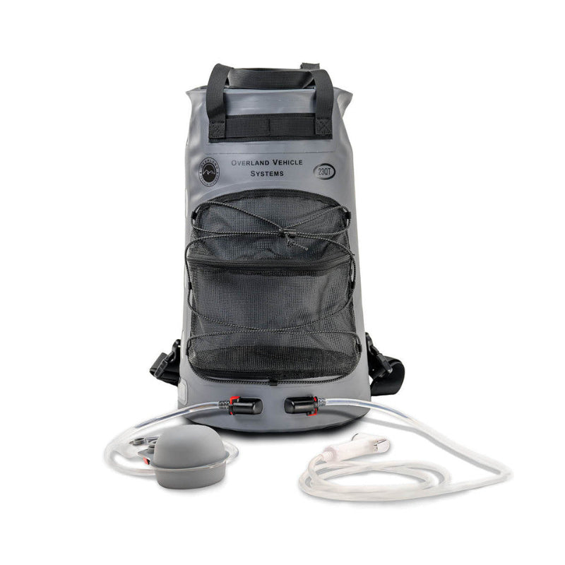Image of Overland Vehicle Systems portable camp shower bag with front mesh pocket, dual hose connections, clear tubing and shower head, gray waterproof roll-top design shown front view on white background