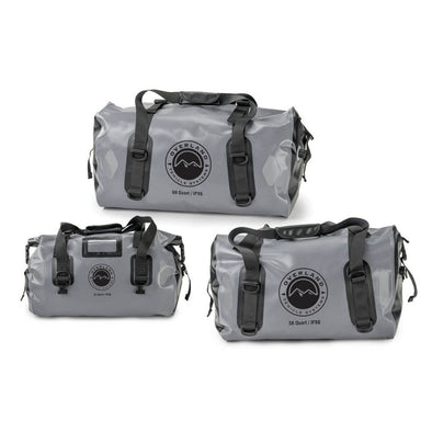 Image of three gray Overland Vehicle Systems IPX6 waterproof duffel bags of varying sizes (69 Quart, 42 Quart, and 58 Quart), each with black straps and the company logo, displayed on a white background.