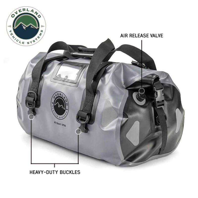 Image of a gray and black 42-quart Overland Vehicle Systems IPX6 waterproof duffel bag, highlighting its heavy-duty buckles and air release valve.