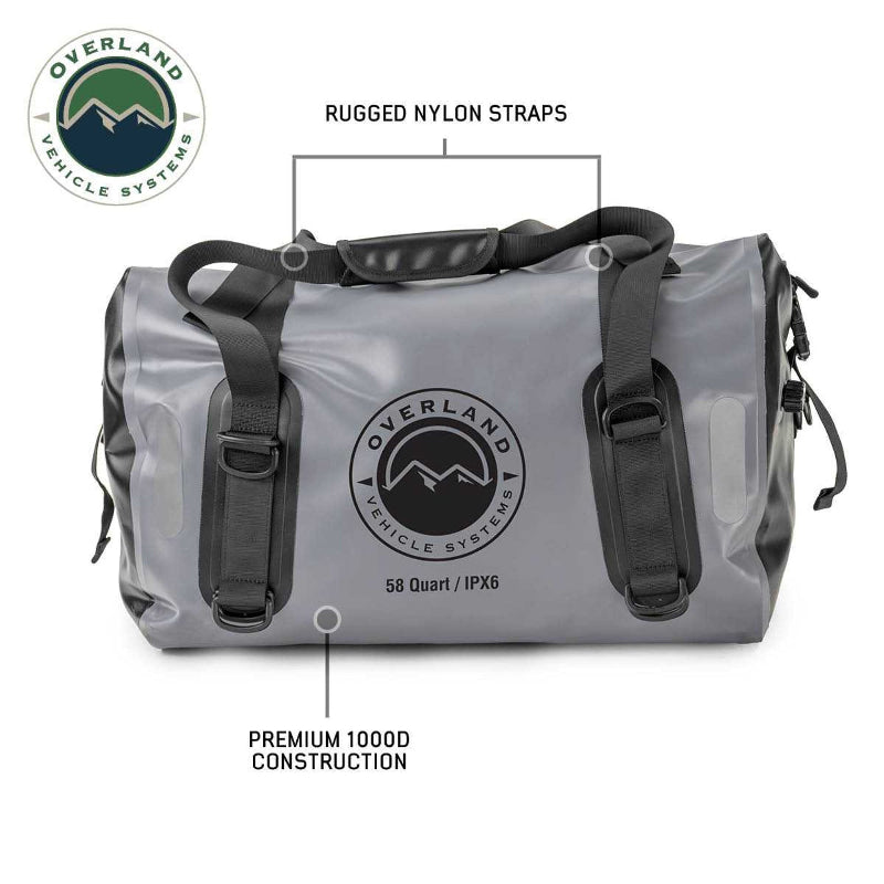 Image of a gray 58-quart Overland Vehicle Systems IPX6 waterproof duffel bag, highlighting its rugged nylon straps and premium 1000D construction.