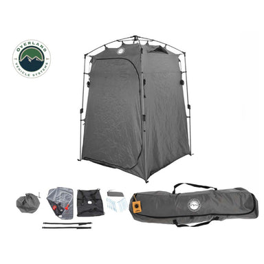 Image of a portable privacy shower tent fully assembled alongside included accessories and carry bag, dark gray fabric with collapsible frame, angled front view on white background.