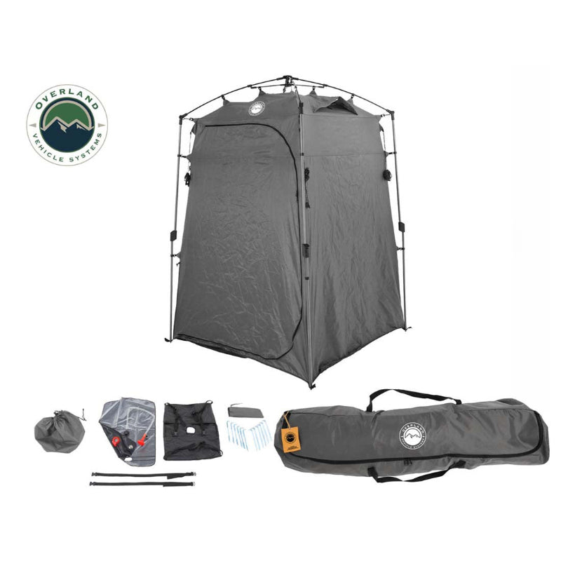 Image of a portable privacy shower tent fully assembled alongside included accessories and carry bag, dark gray fabric with collapsible frame, angled front view on white background.