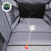 Image of a portable privacy shower tent interior showing waterproof floor, hanging shower bag holder with drain hose, and enclosed gray fabric walls, top-down interior view.