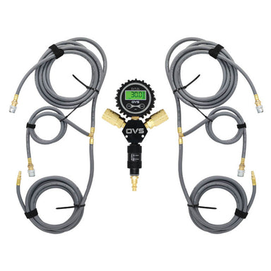 An image of an Overland Vehicle Systems (OVS) D.T.D. digital tire deflator kit designed for four tires. The kit features a central black manifold with a green digital pressure gauge displaying "30.0 PSI," connected to two gray air hoses, each branching into two additional hoses, all with brass fittings and universal quick connect chucks. The hoses are neatly coiled and secured with straps, presented against a clean white background