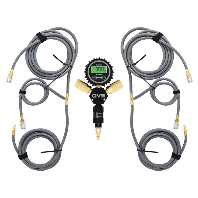 An image of an Overland Vehicle Systems (OVS) D.T.D. digital tire deflator kit designed for four tires. The kit features a central black manifold with a green digital pressure gauge displaying "30.0 PSI," connected to two gray air hoses, each branching into two additional hoses, all with brass fittings and universal quick connect chucks. The hoses are neatly coiled and secured with straps, presented against a clean white background