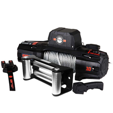 An angled front view of the complete Overland Vehicle Systems (OVS) SCAR Series Winch set on a white background. The set includes the black and orange winch with a steel cable, a silver roller fairlead, a wireless remote control, and a forged steel hook