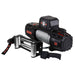 Image of an OVS SCAR 12 Steel Cable Winch, angled front view on a white background. It shows the black winch with a warning label and the number 12, the steel cable spooled, a silver hawse fairlead, and a remote controller