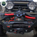 Overland Vehicle Systems SCAR Synthetic Rope Winch mounted on the front bumper of a gray Toyota Land Cruiser. The image shows the winch and its attached accessories, including a shackle, in a real-world application