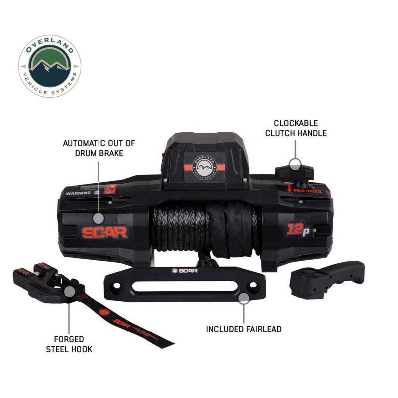Image of the black Overland Vehicle Systems (OVS) SCAR winch, with labels pointing to its main features: the automatic drum brake, clockable clutch handle, forged steel hook, and included fairlead. The winch and all its parts are shown on a white background