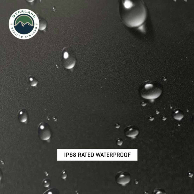 Image of a black, waterproof surface with droplets of water on it, highlighting the IP68 waterproof rating. The surface is part of the Overland Vehicle Systems (OVS) SCAR winch