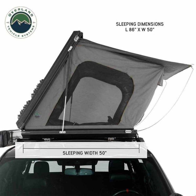 Image showcasing a dark grey hardshell rooftop tent, partially deployed on a vehicle, with text overlays indicating "SLEEPING DIMENSIONS L 86" X W 50"" and "SLEEPING WIDTH 50"". The "Overland Vehicle Systems" logo is in the top left corner, all on a white background