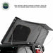 Image of an Overland Vehicle Systems 6061 Aircraft Grade Aluminum Clamshell Roof Top Tent, partially deployed with a dark grey fabric tent body and an extended awning, shown on a white background. The tent is mounted on a vehicle and highlights marine-grade stainless steel hardware