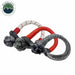 Image of Overland Vehicle Systems soft shackles in multiple sizes with gray braided synthetic rope, black steel collars, and red protective sleeves, grouped together in angled front view on white background.
