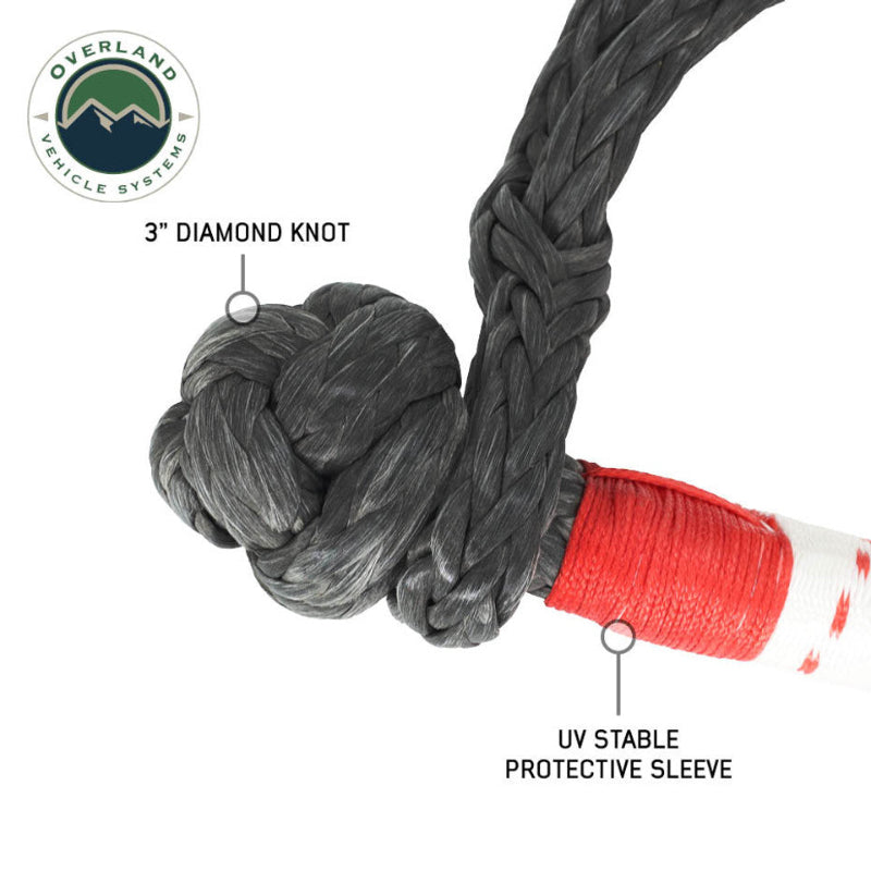Image showing a close-up of a black soft shackle's 3" diamond knot and the red UV stable protective sleeve, on a white background with the "Overland Vehicle Systems" logo.