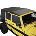 Image of a Black Diamond OVS soft top on a yellow Jeep Wrangler. The soft top is fully installed and shown from a side and front angle.