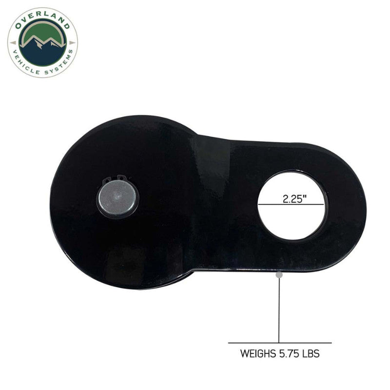 Image of Overland Vehicle Systems standard snatch block showing 2.25-inch mounting hole and 5.75-pound weight, black heavy-duty recovery pulley displayed in top view on white background.