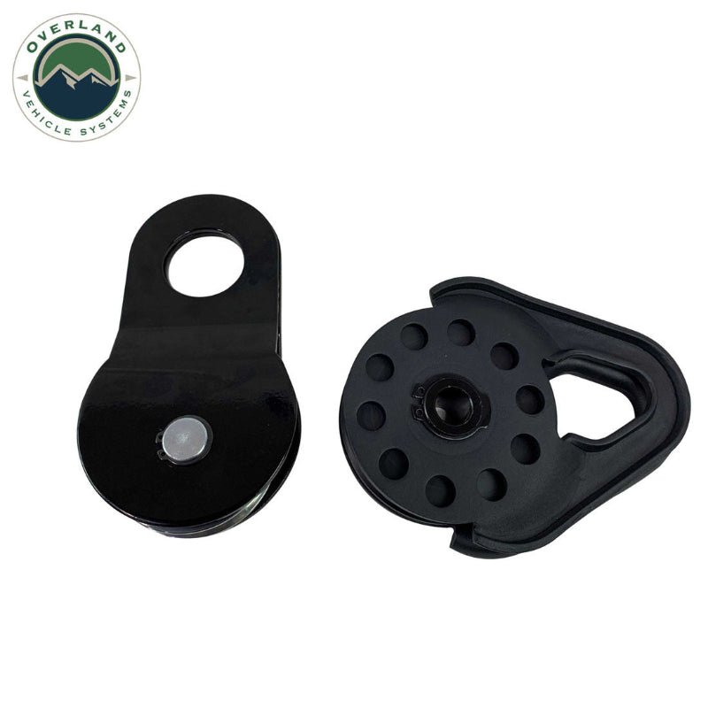 Image of Overland Vehicle Systems standard snatch block shown assembled and disassembled, black heavy-duty recovery pulley with removable side plate, front and side view on white background.
