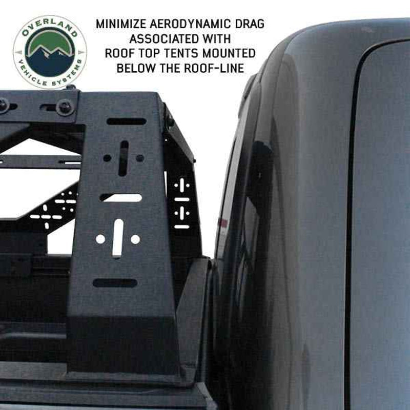 Image of mid-height truck bed rack with design features to minimize aerodynamic drag, showcasing the close-up view of the rack mounted on the truck, emphasizing the streamlined structure for mounting roof-top tents below the roof-line