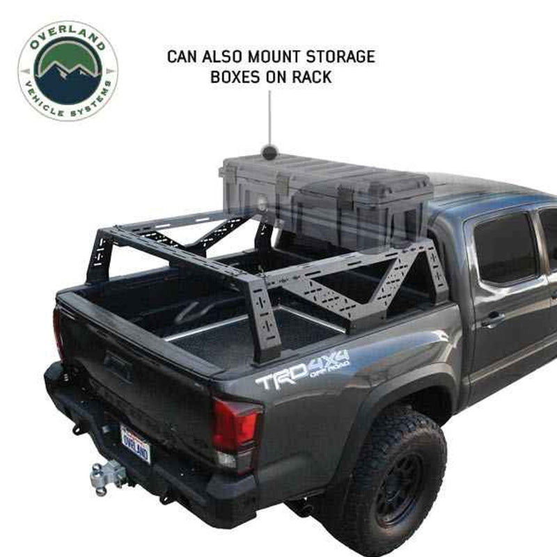 Image of mid-height pickup truck rack with storage box mounted on top, showcasing the sturdy frame and versatility for additional storage options, viewed from the rear of the truck with clear visibility of the rack and truck design