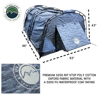 Image of the Overland Vehicle Systems Khumbu 2-person Soft Shell Tent with its dimensions of 86" x 63" x 43" shown. A close-up of the tent fabric highlights the "Overland Vehicle Systems" logo and text stating "PREMIUM 320G RIP STOP POLY COTTON OXFORD FABRIC MATERIAL WITH A 5000 PU WATERPROOF COAT RATING" on a white background