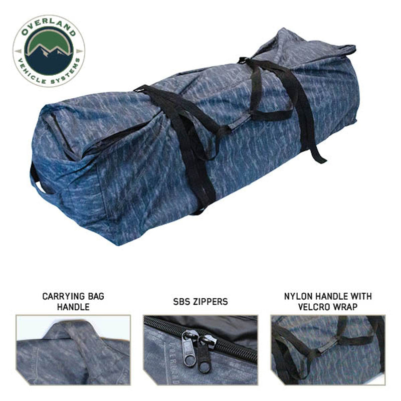 Image of the Overland Vehicle Systems Khumbu 4-person Soft Shell Tent in its rolled-up carrying bag. The image highlights the carrying bag handle, SBS zippers, and the nylon handle with a Velcro wrap, all on a white background