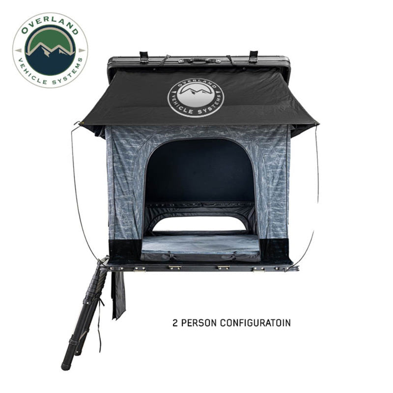 Image of Overland Vehicle Systems Lhotse rooftop tent in 2-person configuration, featuring black and gray fabric, with a front view showing the entrance and support leg