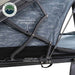 Image of Overland Vehicle Systems Lhotse rooftop tent featuring an X-hinge clamshell opening design and nitrogen gas charged struts, close-up view of the structure with blue fabric on a white background