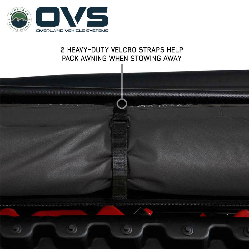 Image of a rolled-up OVS awning secured with two heavy-duty velcro straps, demonstrating how they help pack the awning when stowing away.
