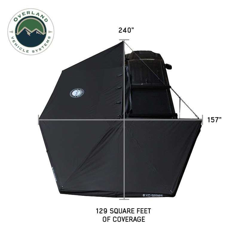 Image showcasing a black Overland Vehicle Systems 270-degree awning fully deployed, displaying 129 square feet of coverage with a width of 240 inches at its widest point and a depth of 157 inches from the vehicle. The awning is shown from an aerial perspective on a white background