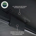 Image showing black Overland Vehicle Systems awning fabric with hanging loops to roll up and secure doors and windows. The awning is partially deployed, and the "Overland Vehicle Systems" logo is in the top left corner