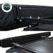 Image providing a close-up view from underneath a black Overland Vehicle Systems awning, highlighting the 5000 PU black out undercoating of the fabric. The "Overland Vehicle Systems" logo is in the top left corner