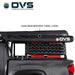 Image of an OVS XD Nomadic 270 LTE awning stored in its black 840D waterproof travel cover mounted on a pickup truck rack, shown in side view on a white background.